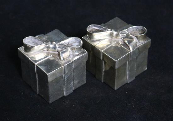 A pair of novelty sterling silver condiments by Tiffany & Co, Philippines, modelled as gift wrapped presents, 36mm.